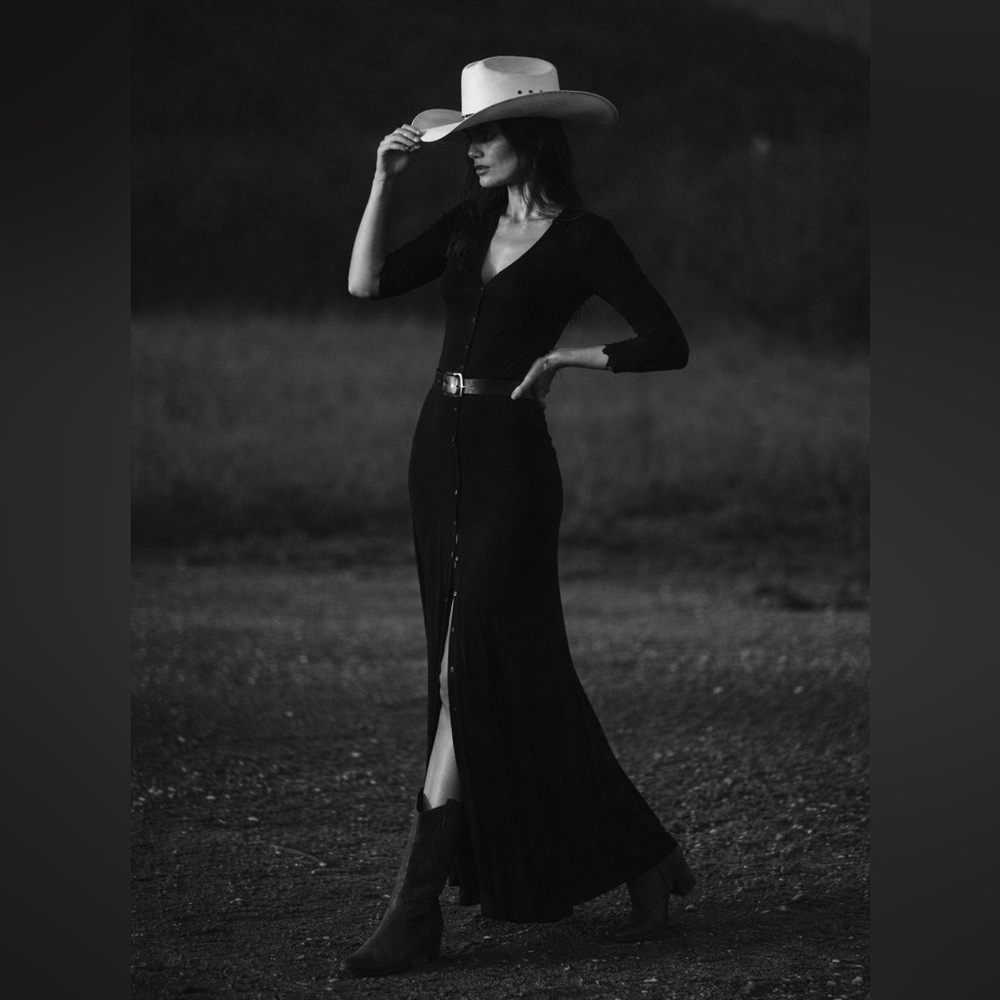 Minimalist black long sleeve v-neck button-front midi dress.
